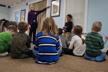 Ms. Karen explains how the zip line will move up during the session.