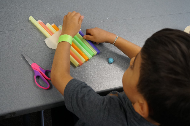 Fold the tape over the top to hold them together.