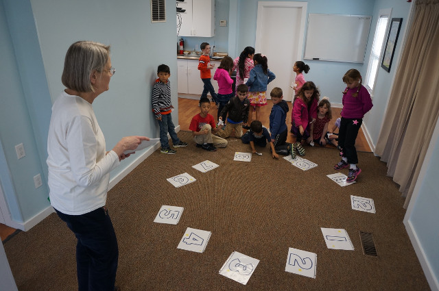 Ms. Karen made a giant clock on the floor.