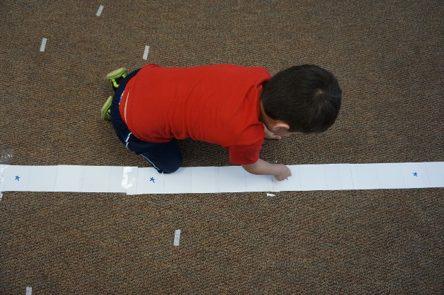 Everybody counts how far they threw the roll...