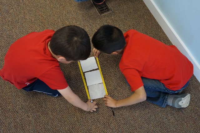 It looks like three squares make 1 foot.