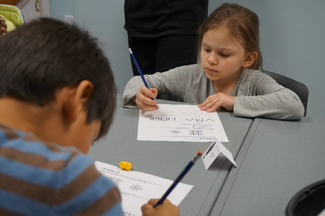 Then we write our name in pigpen code.