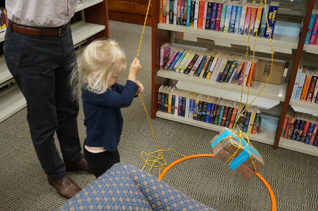 Even a 2 year old can lift two heavy bricks if she uses a pulley!